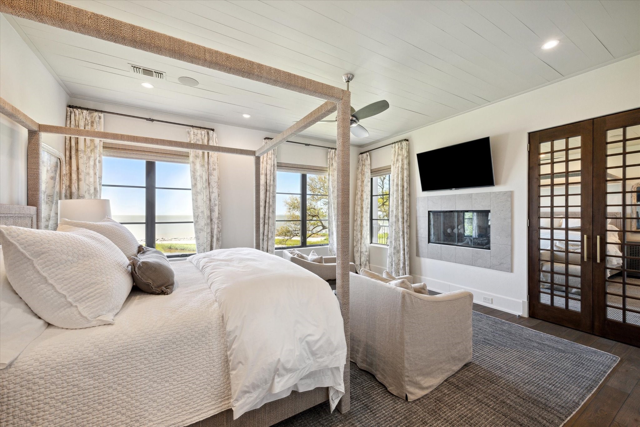 633 Quintana Roo Place Seabrook, TX 77586 - Photo 21 of 47 The primary suite is in a word: tranquility. It is complete with a fireplace, expansive views, a spa-like en suite bath with its own washer/dryer, and a grand walk-in closet.