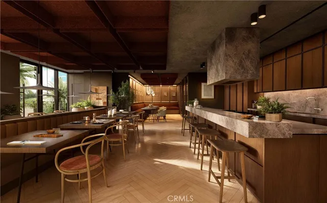 a kitchen with table chairs stove and flat screen tv