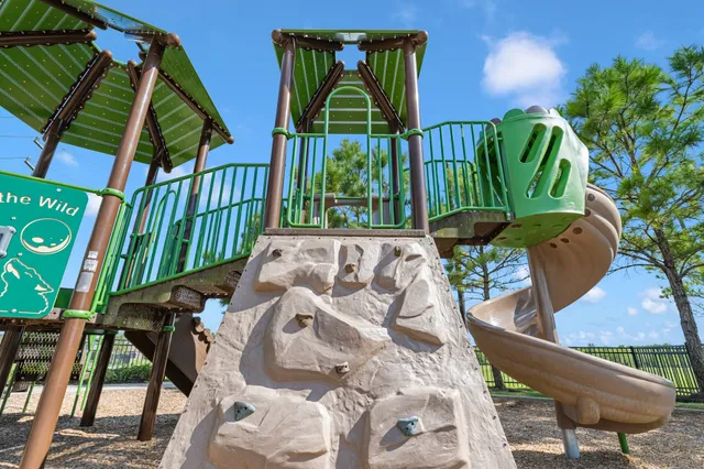 a view of a playground with basketball court