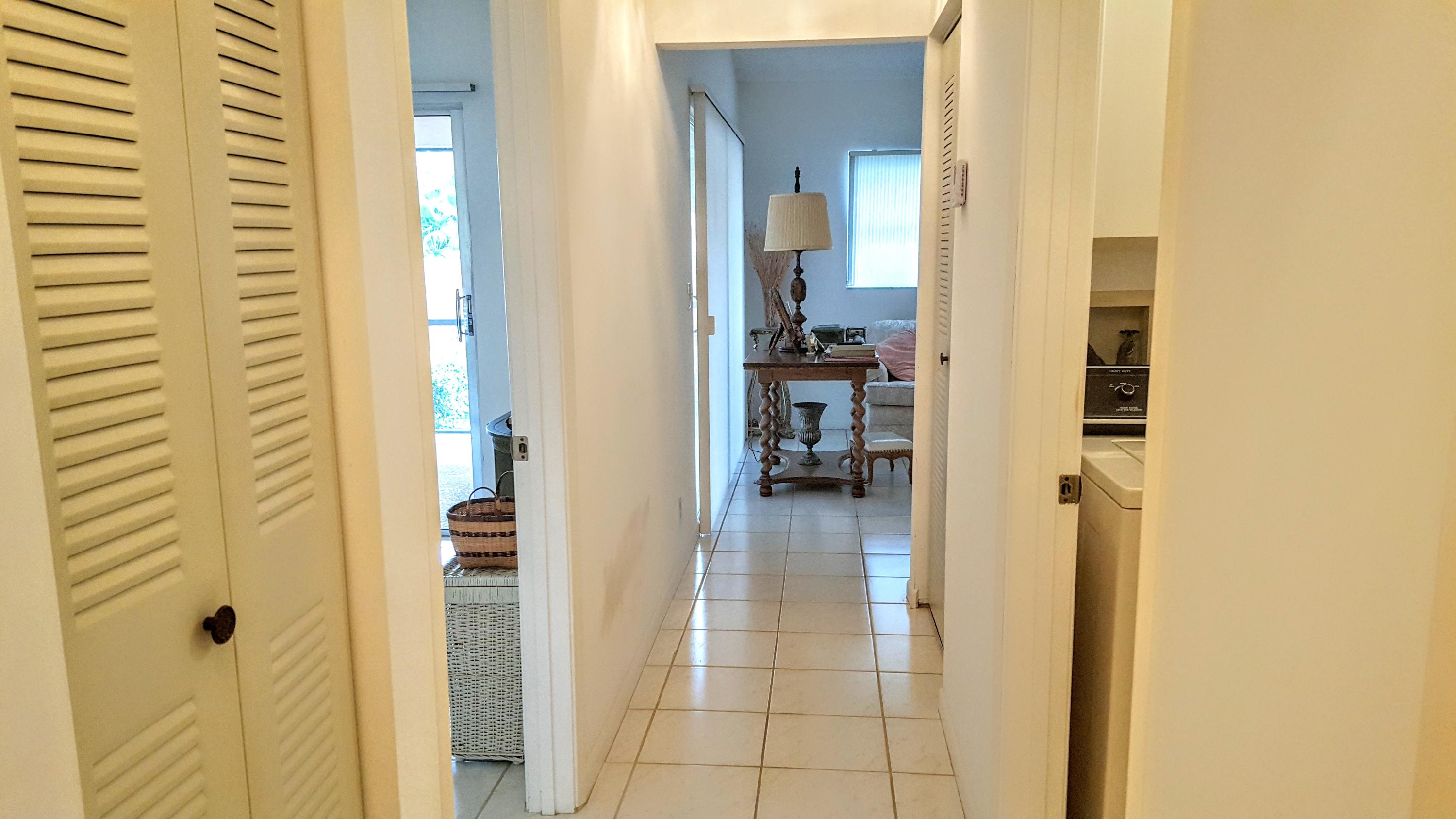 8228 Sweetbriar Way, Unit B Boca Raton, FL 33496 - Photo 33 of 35 hallway from bedroom to living