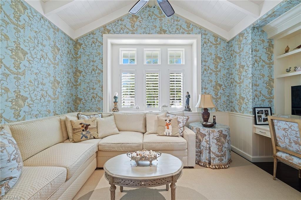 163 10th Avenue South Naples, FL 34102 - Photo 19 of 50 a living room with furniture and a large window