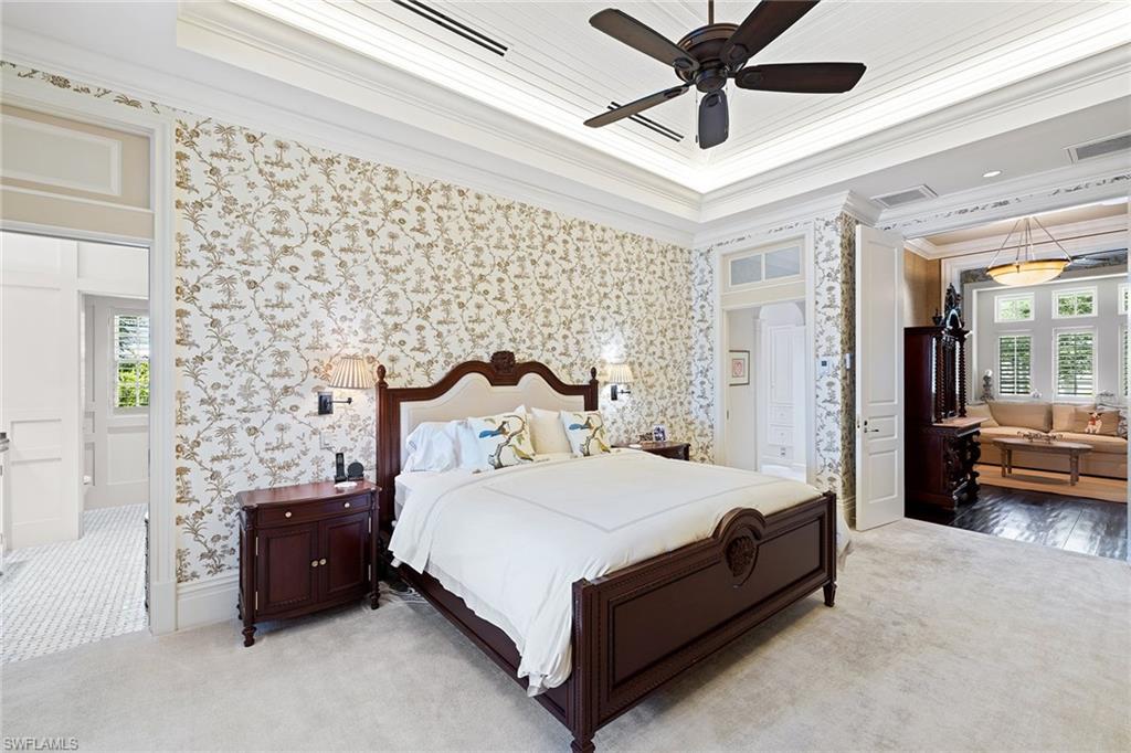 163 10th Avenue South Naples, FL 34102 - Photo 21 of 50 a bedroom with a bed and ceiling fan