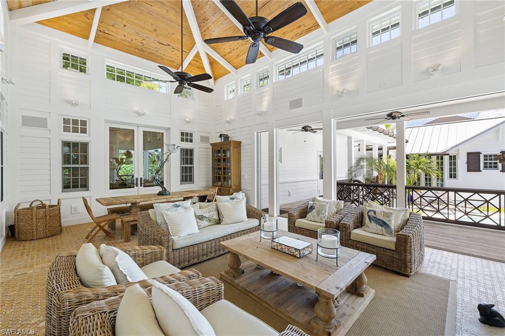 163 10th Avenue South Naples, FL 34102 - Photo 33 of 50 a living room with furniture and a large window