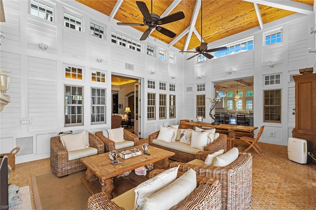163 10th Avenue South Naples, FL 34102 - Photo 35 of 50 a view of a patio with couches chairs and potted plants