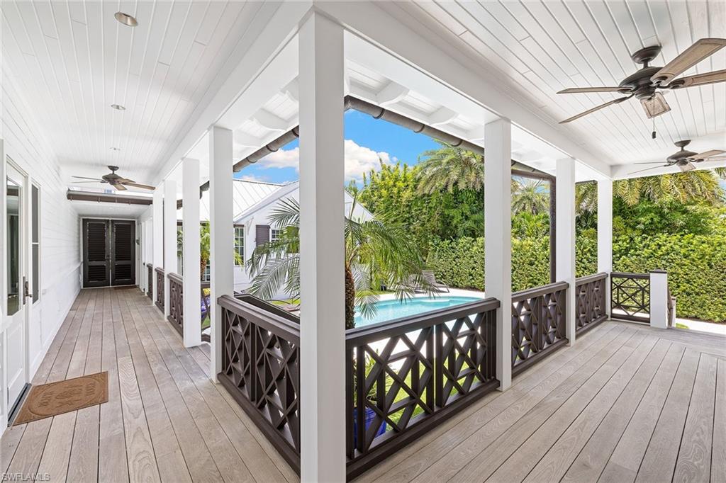 163 10th Avenue South Naples, FL 34102 - Photo 38 of 50 a view of a porch with wooden floor
