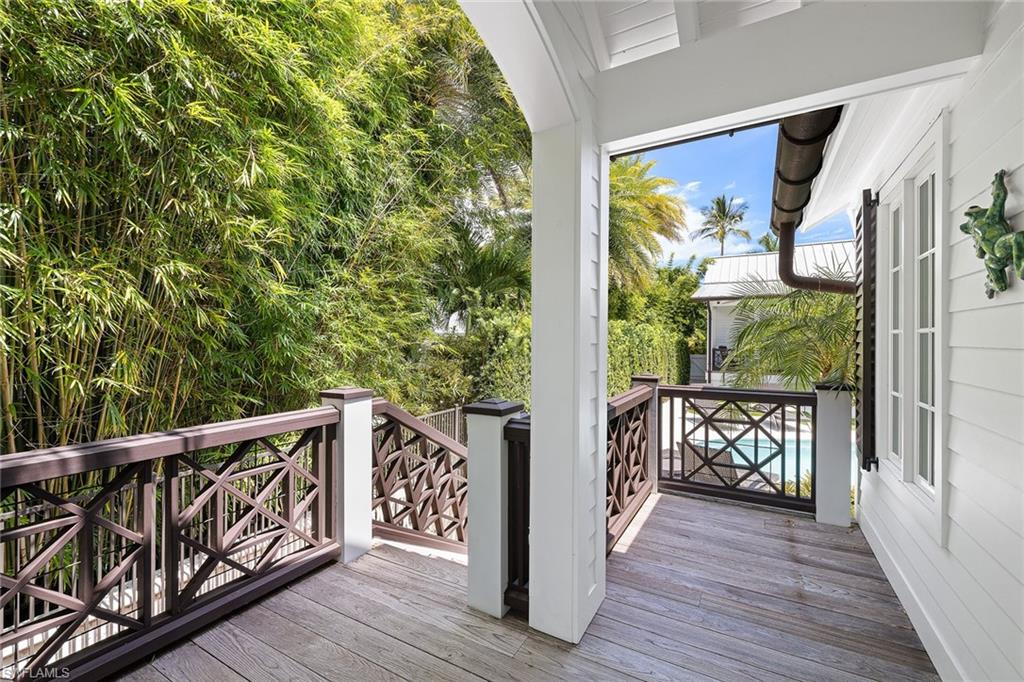 163 10th Avenue South Naples, FL 34102 - Photo 42 of 50 a view of balcony with wooden floor