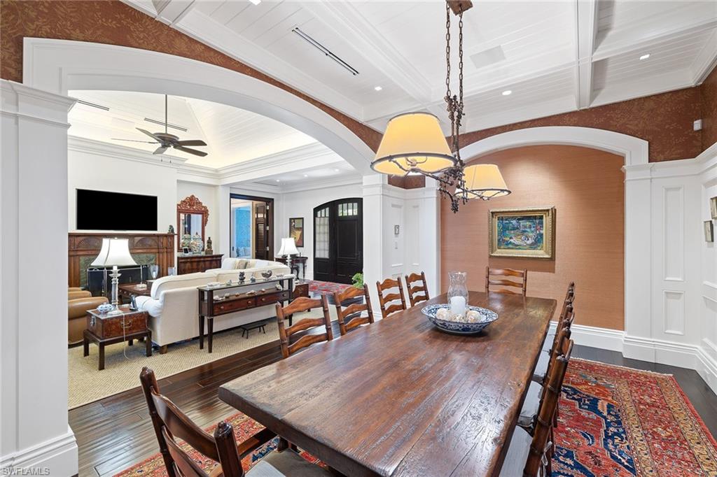 163 10th Avenue South Naples, FL 34102 - Photo 10 of 50 a living room with furniture fireplace and a flat screen tv