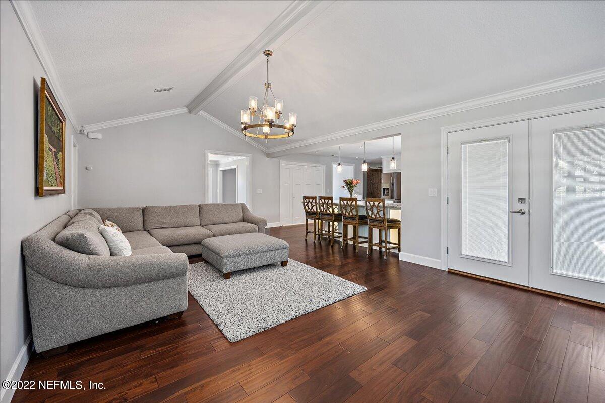 9410 Woodhaven Road Jacksonville, FL 32257 - Photo 11 of 27 a living room with furniture and a wooden floor