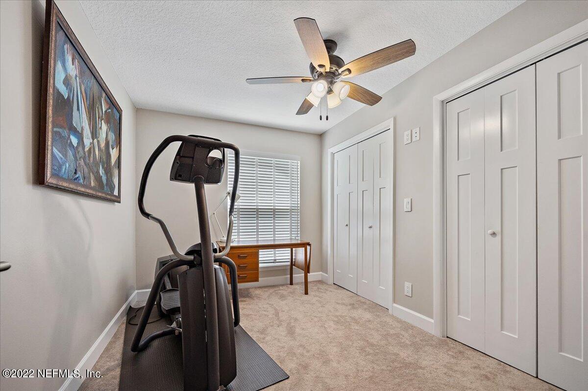 9410 Woodhaven Road Jacksonville, FL 32257 - Photo 25 of 27 a view of a room with gym equipment