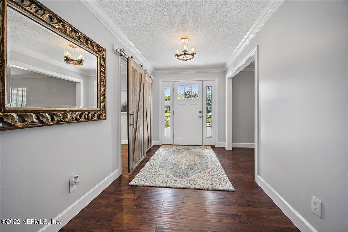 9410 Woodhaven Road Jacksonville, FL 32257 - Photo 3 of 27 wooden floor in an empty room