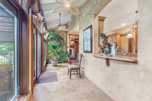 a view of a chairs and table in a balcony