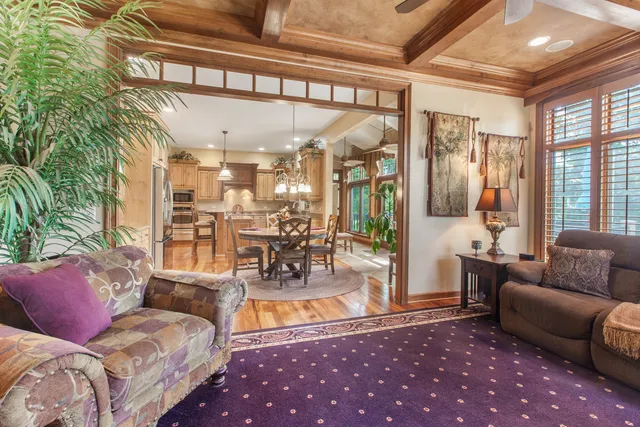 a living room with furniture and a chandelier