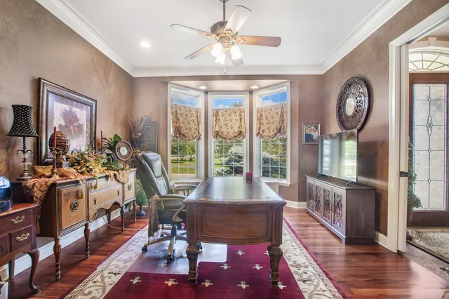 a very nice looking living room with a large window