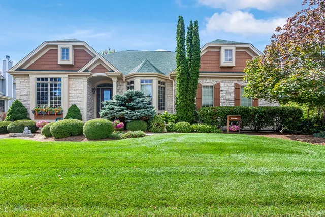 a front view of a house with a yard