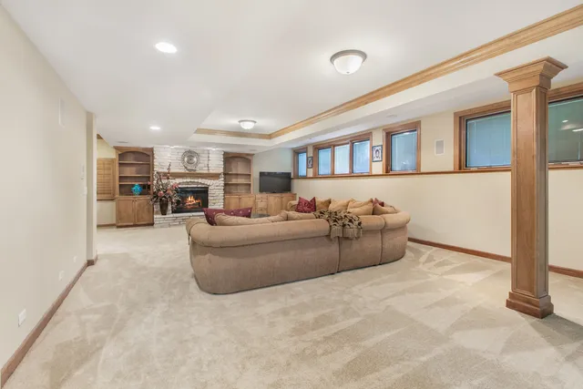 a living room with furniture and a fireplace