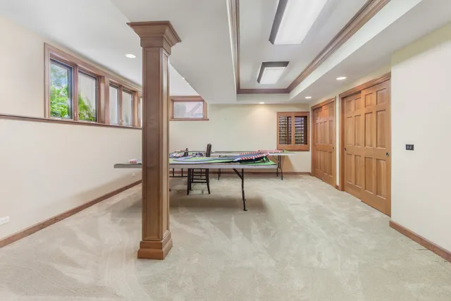 a view of a livingroom with furniture and staircase