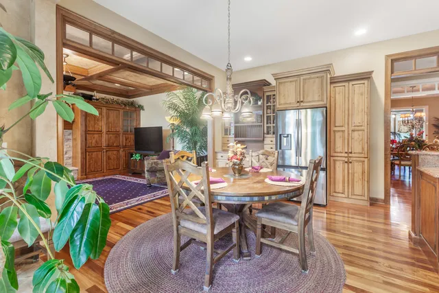a dining room with furniture and wooden floor