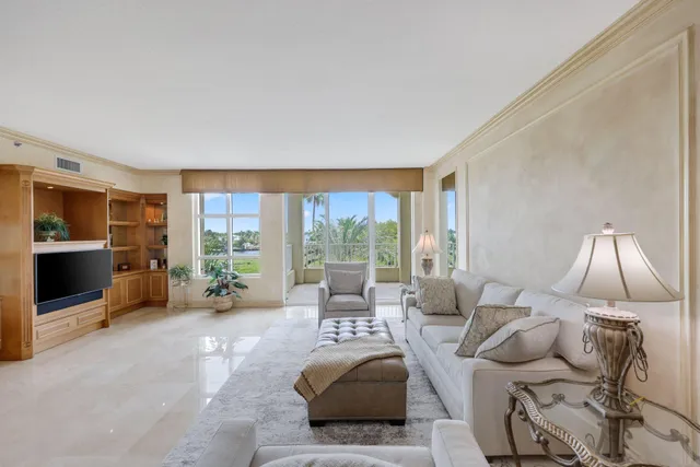 a roof deck with table and chairs