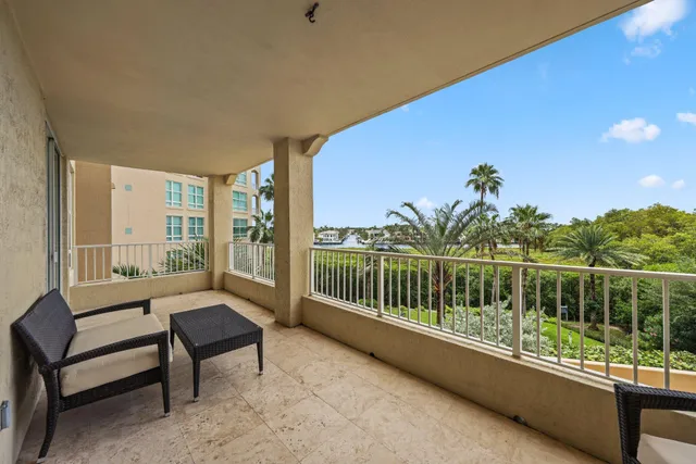 a kitchen with granite countertop a sink a center island and cabinets