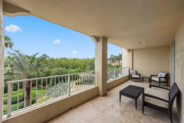 a kitchen with granite countertop a sink stainless steel appliances and white cabinets