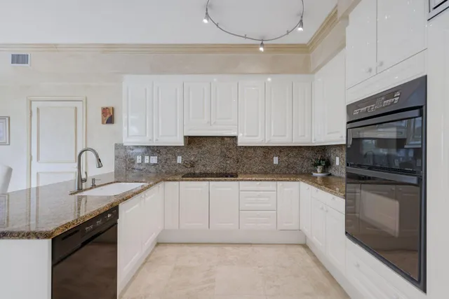 a spacious bedroom with a bed and wooden floor
