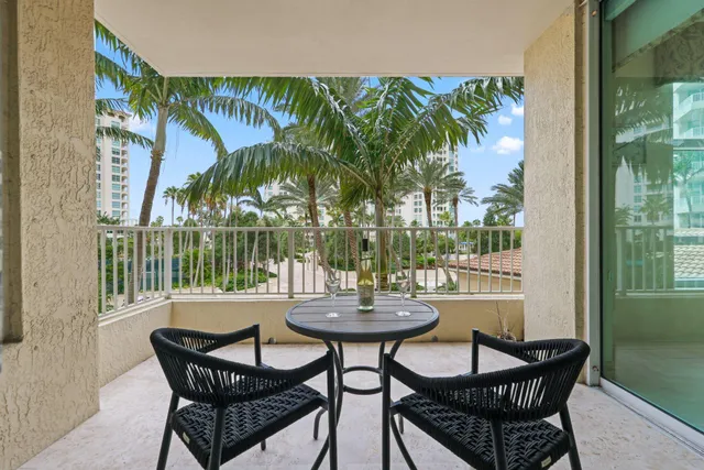 a bedroom with a large bed and a flat tv screen on dresser