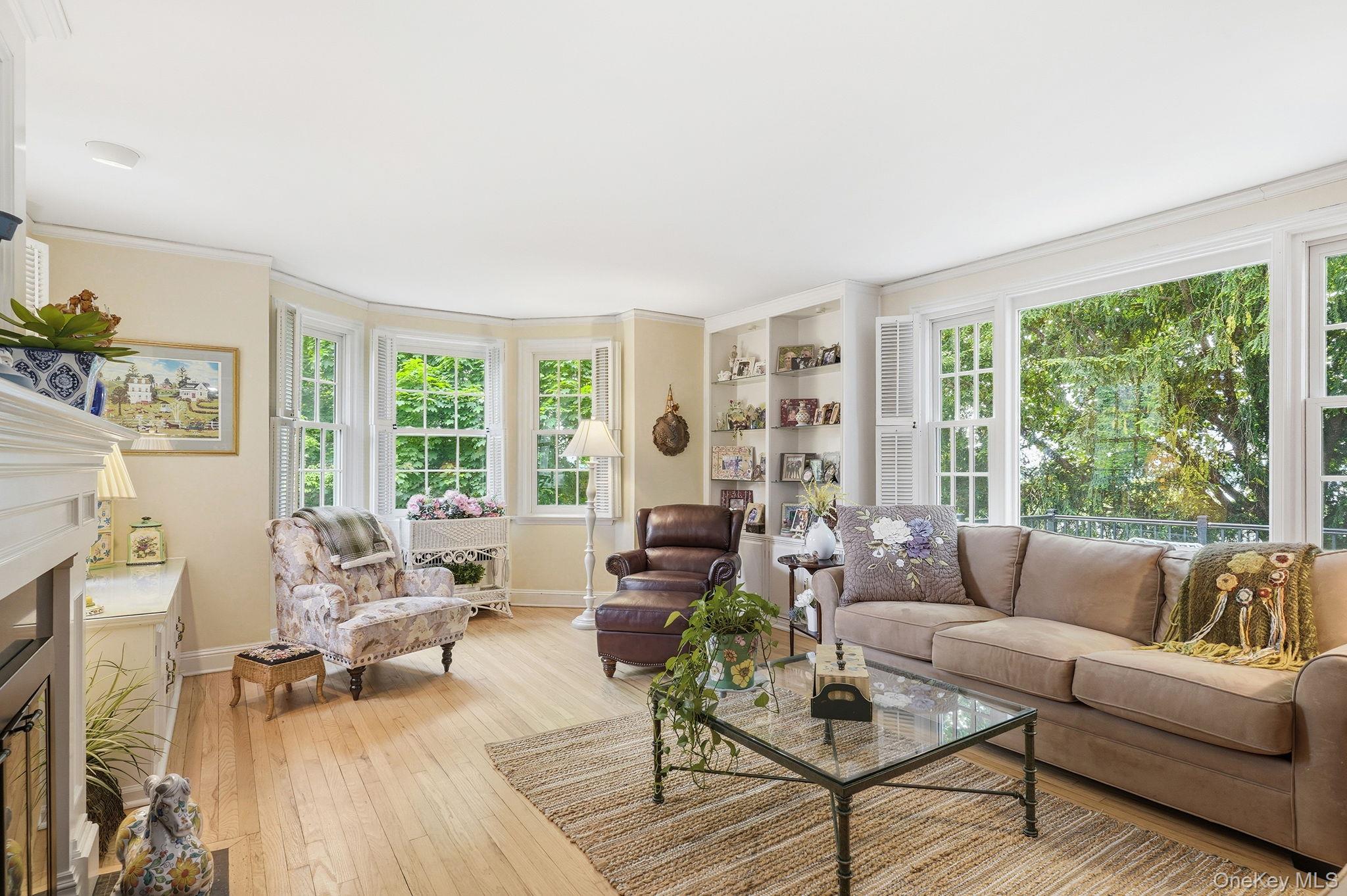 26 Cedarlawn Road Irvington, NY 10533 - Photo 8 of 34 a living room with furniture and large windows