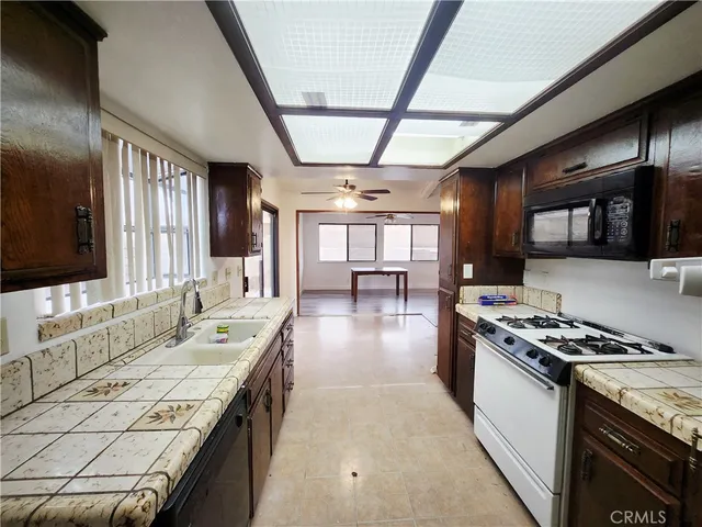 a kitchen with a stove and a sink