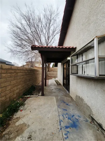 a view of a balcony with a tree