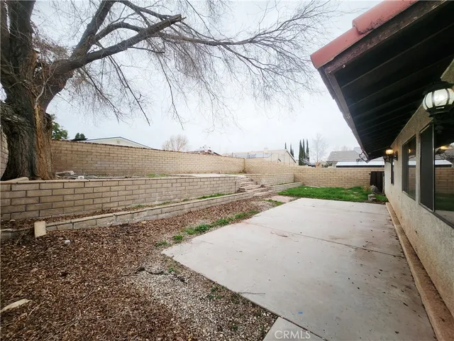 a view of a backyard of the house