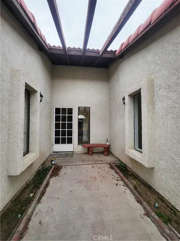 a view of a house with a wooden deck