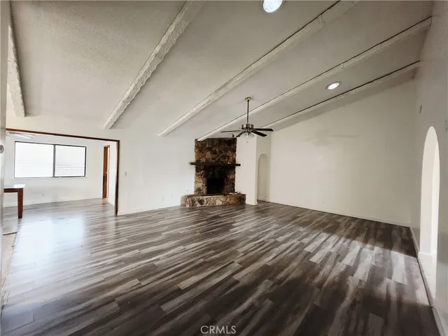 a view of a livingroom with wooden floor