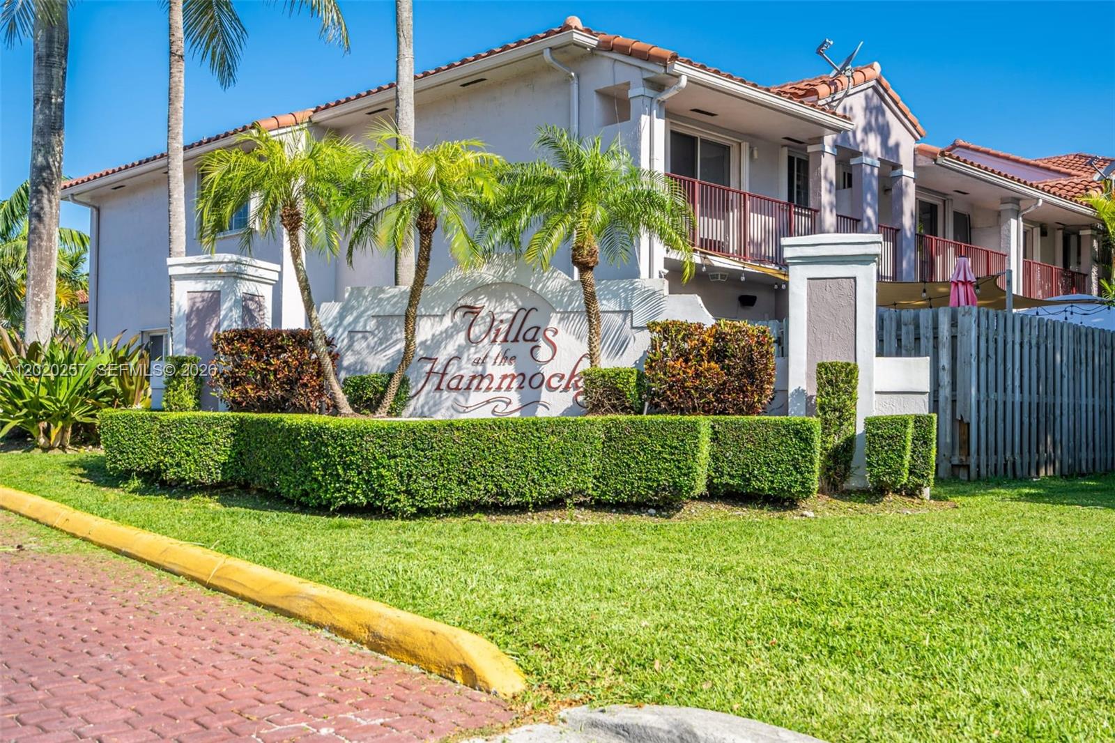 10245 Southwest 154th Place, Unit 1123 Miami, FL 33196 - Photo 1 of 38 a front view of a house with a yard