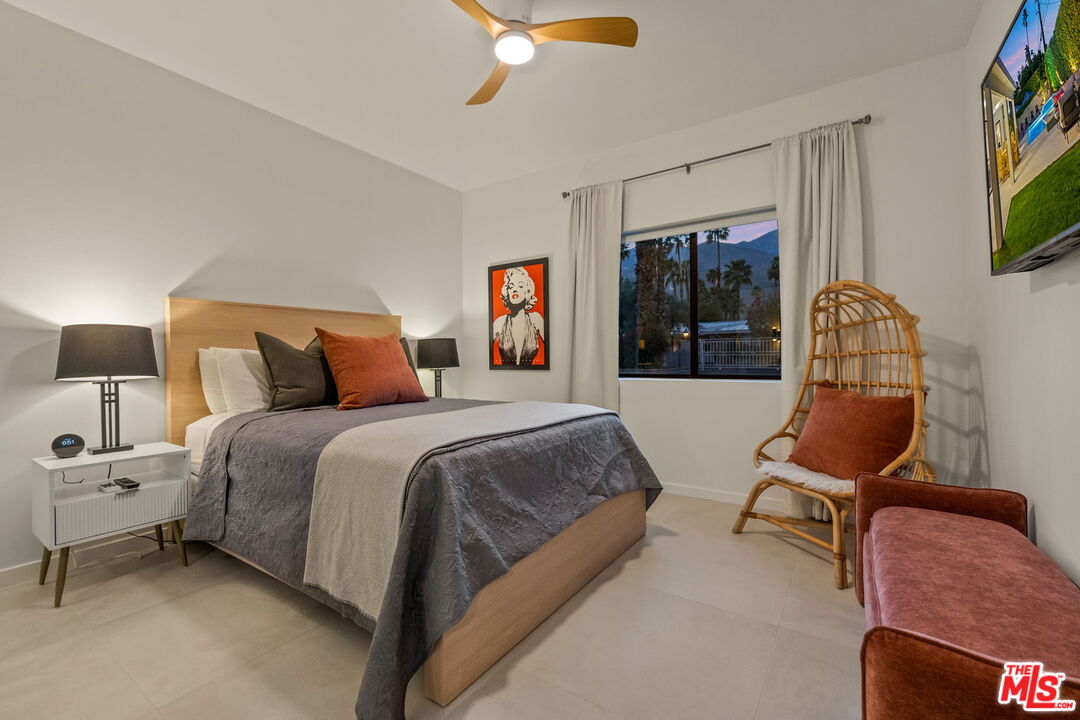 1414 Sagebrush Road Palm Springs, CA 92264 - Photo 38 of 48 a bedroom with a large bed and furniture