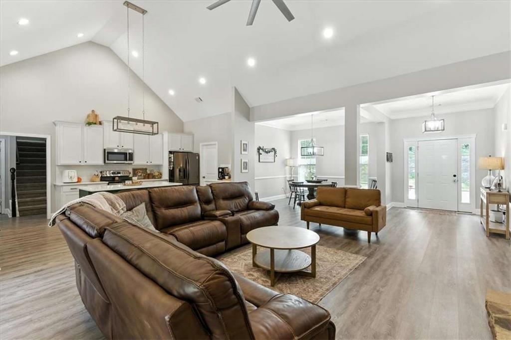 62 Joe Rowell Road Buchanan, GA 30113 - Photo 13 of 63 a living room with furniture kitchen view and a wooden floor
