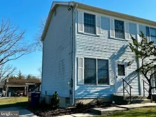 a view of house and car parked