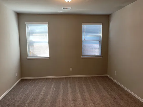 a view of a room that has a window in it