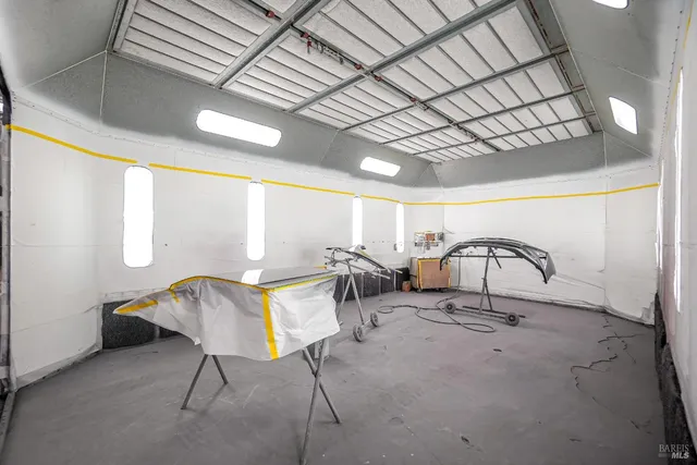 a dining room with furniture and a potted plant