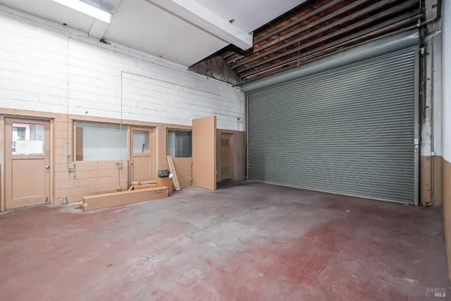 a view of a patio with table and chairs
