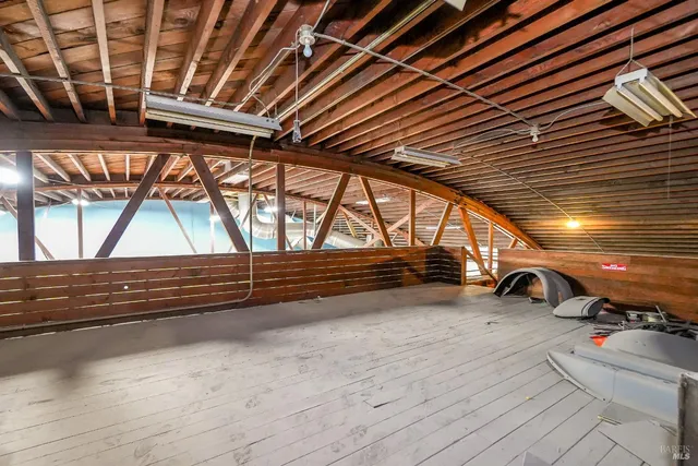 a view of kitchen with furniture and wooden floor