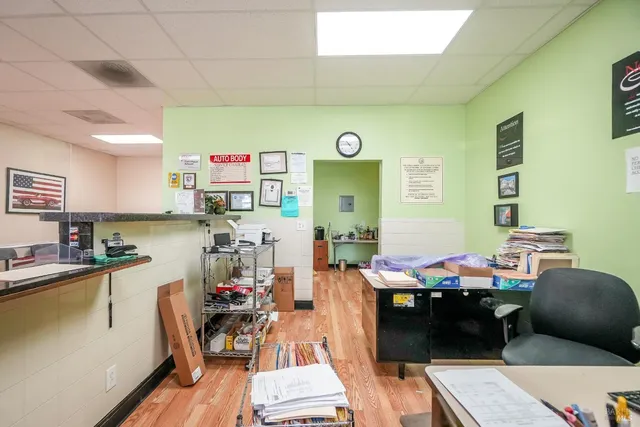 a building with car parked in front of it