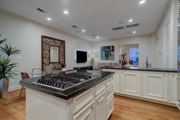 a kitchen with a stove and cabinets