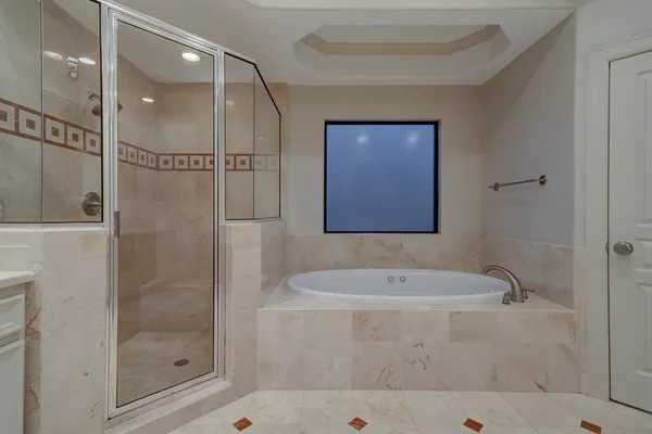 a bathroom with a sink a mirror and a shower