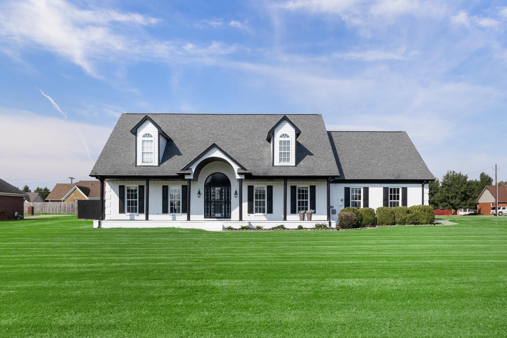 369 Rosemark Road Atoka, TN 38004 - Photo 1 of 27 a front view of a house with a garden