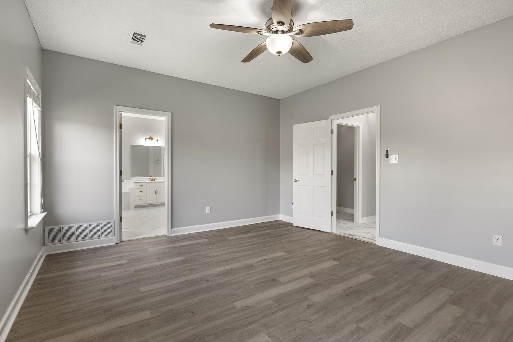 369 Rosemark Road Atoka, TN 38004 - Photo 15 of 27 a view of empty room with wooden floor and ceiling fan