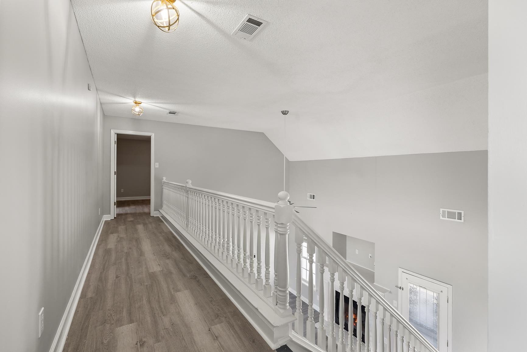 369 Rosemark Road Atoka, TN 38004 - Photo 18 of 27 a view of a hallway with wooden floor