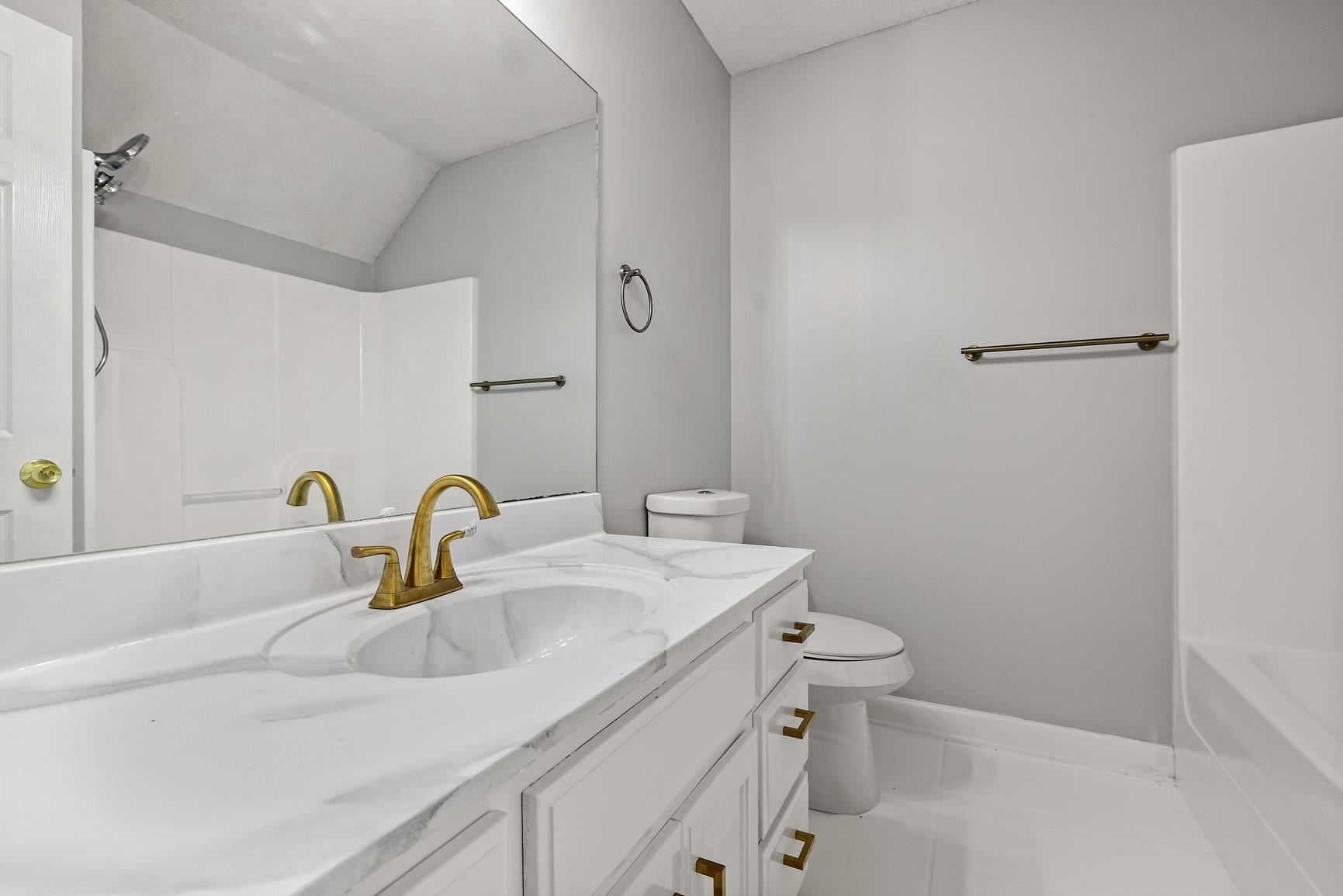 369 Rosemark Road Atoka, TN 38004 - Photo 20 of 27 a bathroom with a sink toilet and a mirror