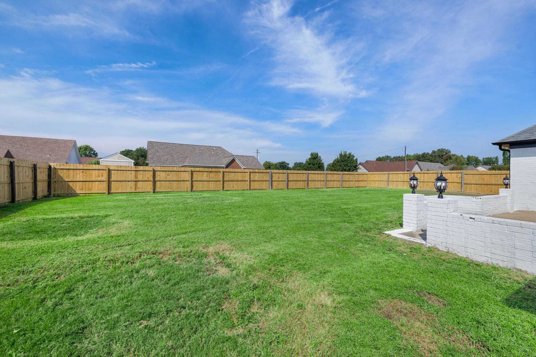 369 Rosemark Road Atoka, TN 38004 - Photo 25 of 27 a view of a garden with a building in the background