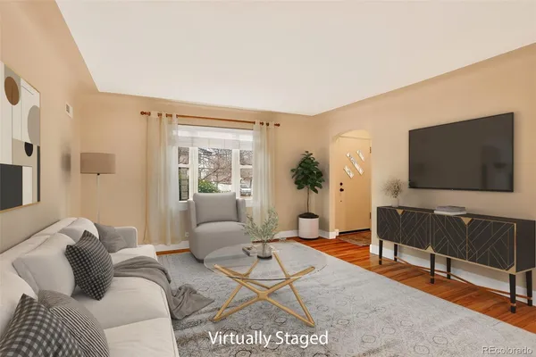 a living room with furniture and a flat screen tv