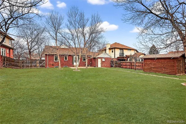 a view of a house with a big yard